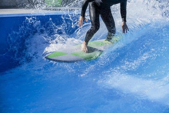 Person surfing in a wave pool