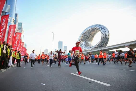 Dubai mass event, running, with the museum of the future in the background.