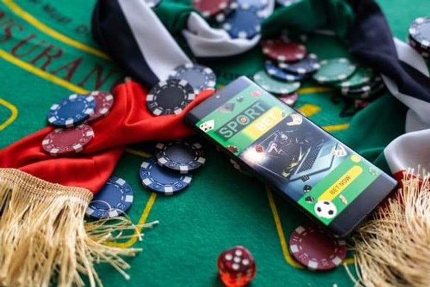 UAE flag on a roulette table among chips.