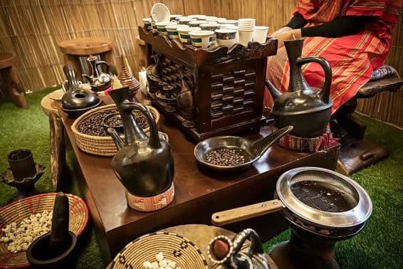 Arabic cafe, coffee pot and a coffee mug on a table, Arabic style coffee.