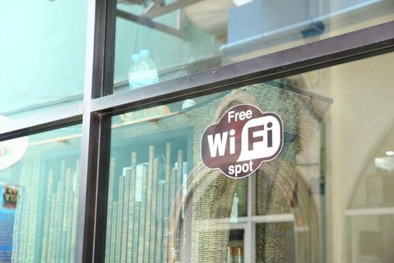 Sign in a café window advertising free WiFi.