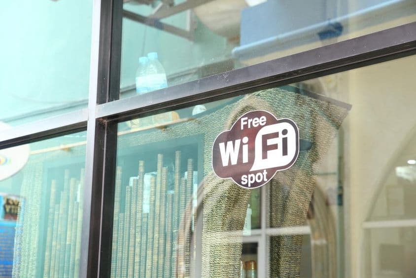 Sign in a café window advertising free WiFi.