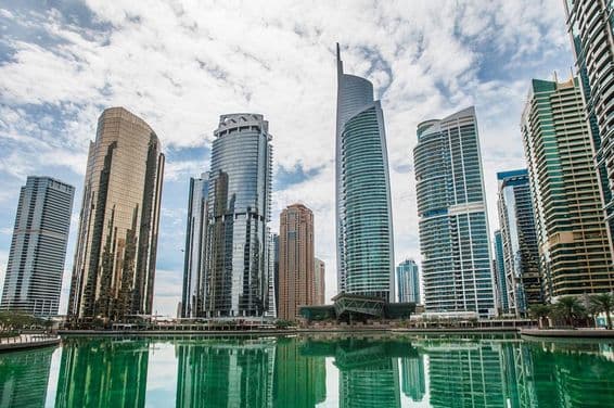 JLT skyscrapers with water in the foreground.