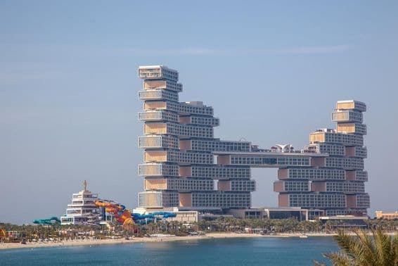 The Royal Atlantis Resort Residence at The Palm hotel with slides visible from inside.