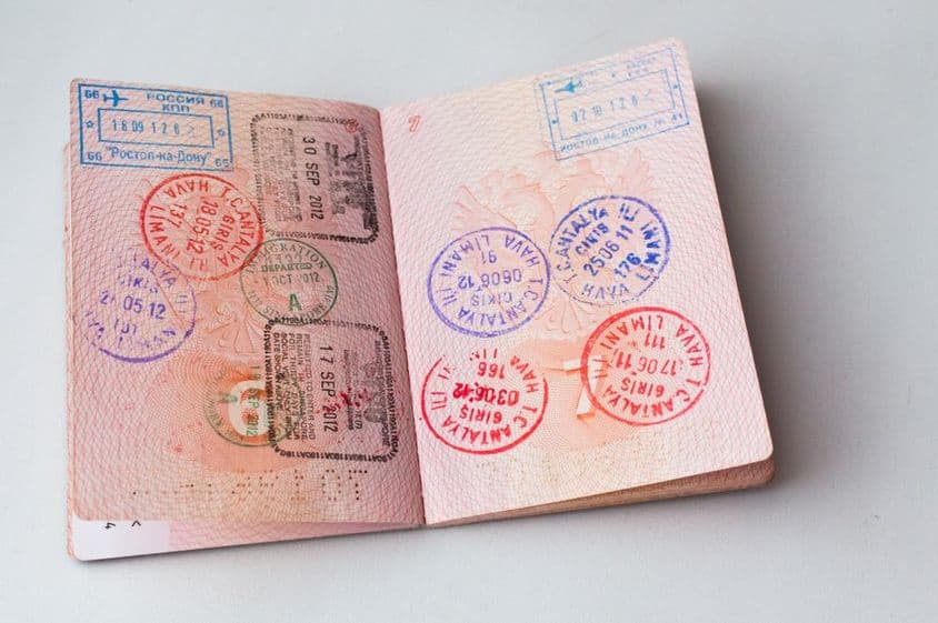 Passport inner page filled with stamps.