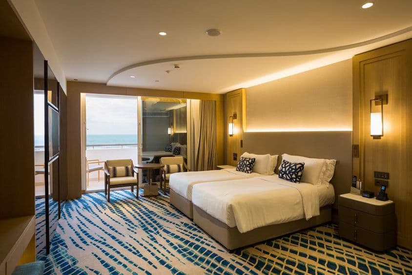 Hotel apartment room detail in Dubai, with bed and view.