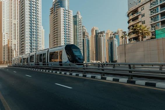 Dubai tram with skyscrapers in the background.