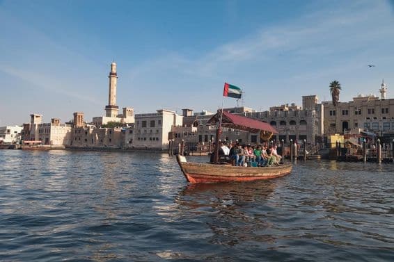 People sitting on a Dubai abra boat.