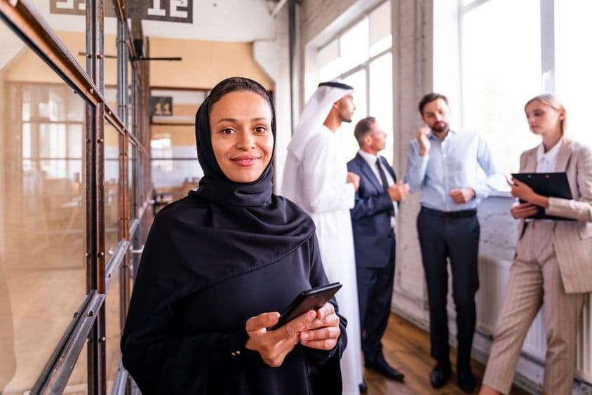 UAE workers in a hallway.
