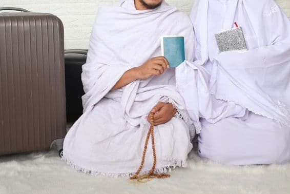 A Muslim couple ready for Umrah.