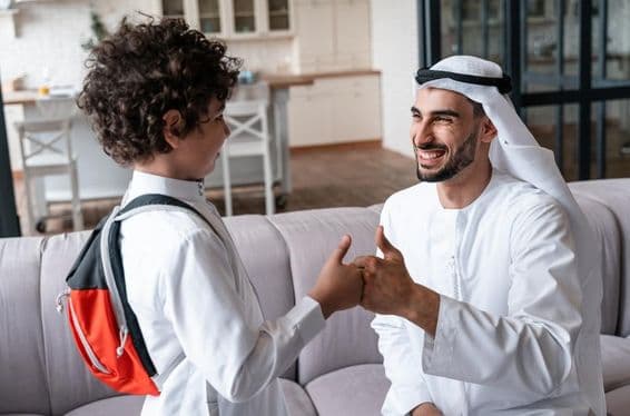 An Arab father and son preparing for school.