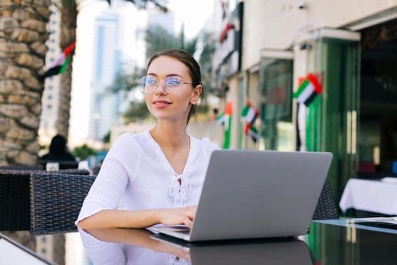 Young girl working with a laptop.