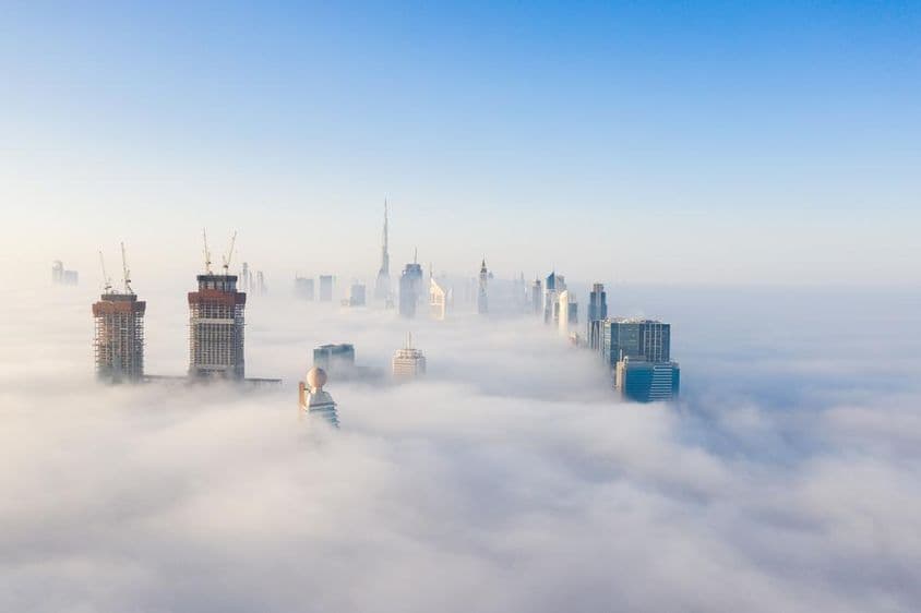 Skyscrapers in Dubai shrouded in fog.