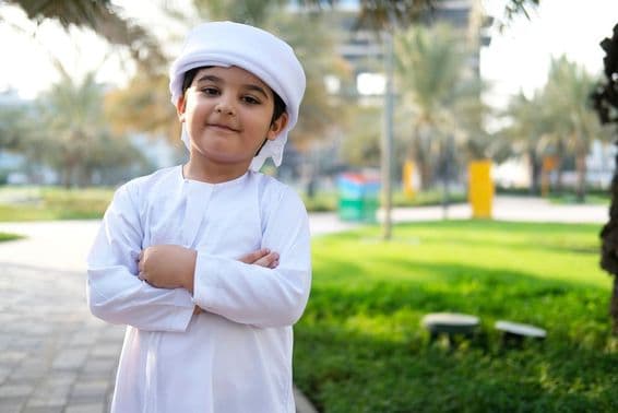 Happy 8-year-old child in a park in Dubai.