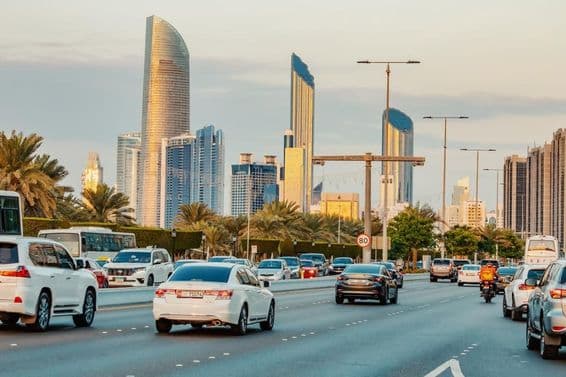 Cars driving on a road in Abu Dhabi.