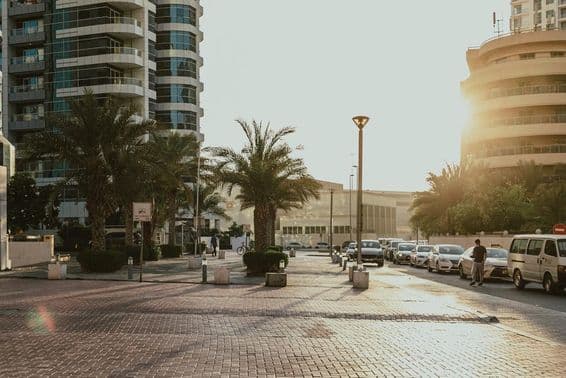 A street view of Dubai with cars.
