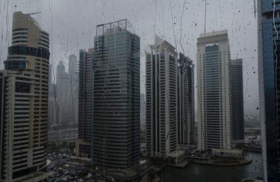 Dubai rain, skyline viewed through rain-dappled glass.