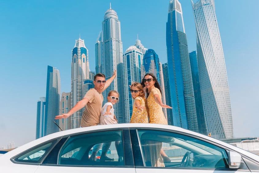 Family vacation with skyscrapers in the background.