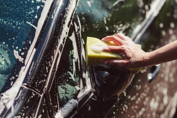 Car being washed with a sponge.