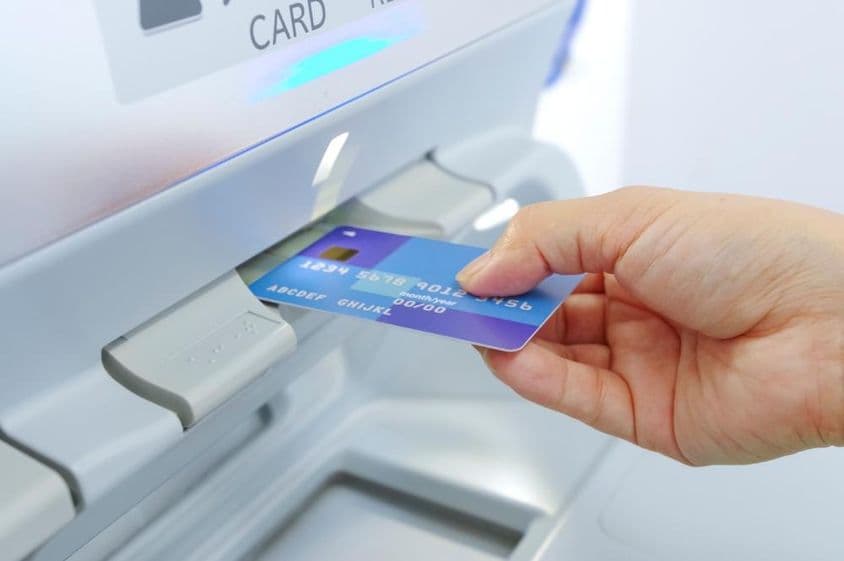 Cash withdrawal from an ATM with a bank card.