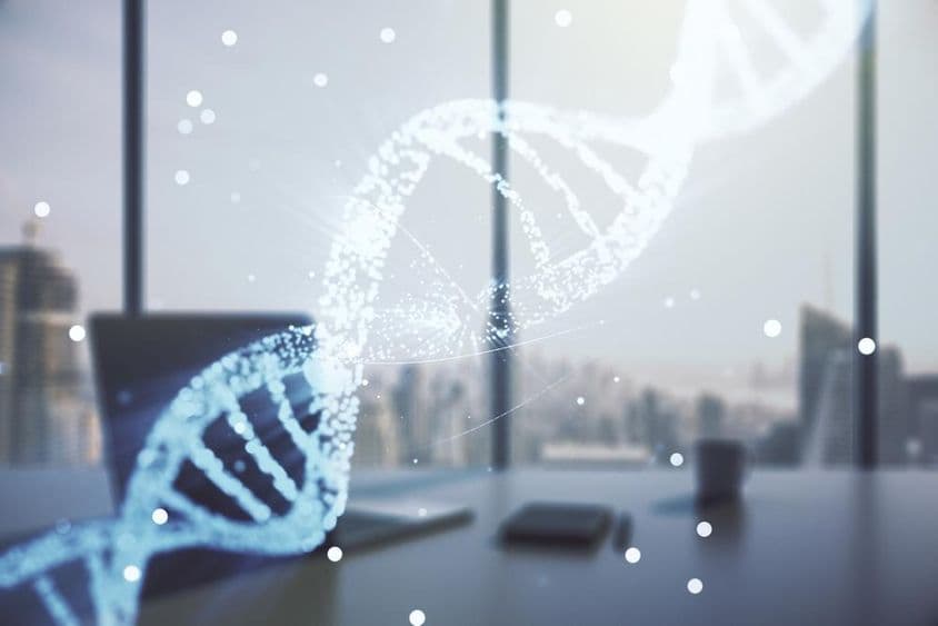 DNA chain projected as a hologram with an office in the background.