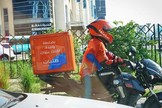 Food delivery riders at work on the street.