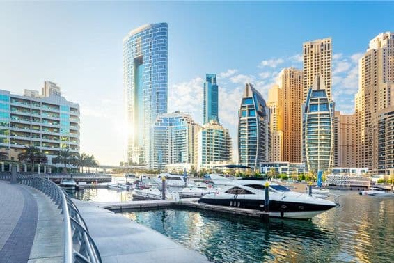 View of Dubai Marina with modern buildings and yachts.