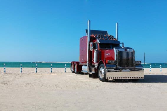 Truck parked on Dubai beachfront.
