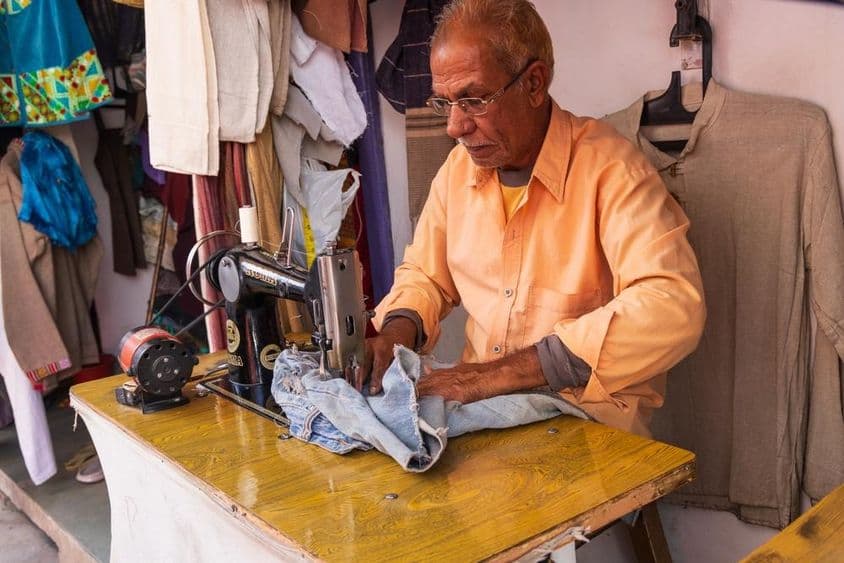 Tailor repairing clothes.