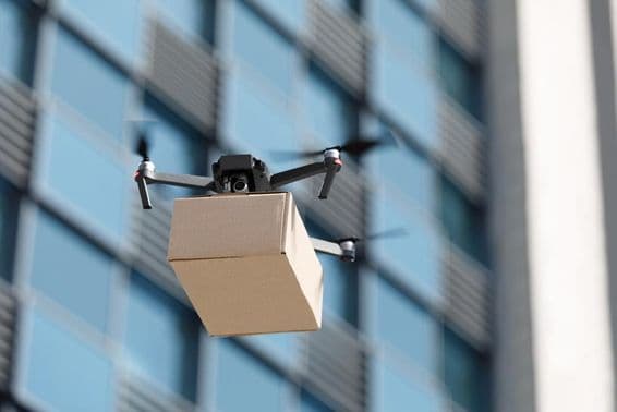 Drone carries a package.
