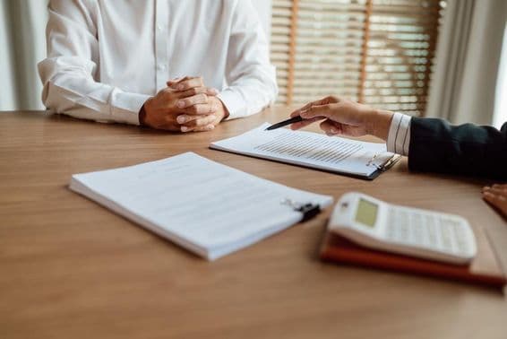 Insurance agent signing a contract.
