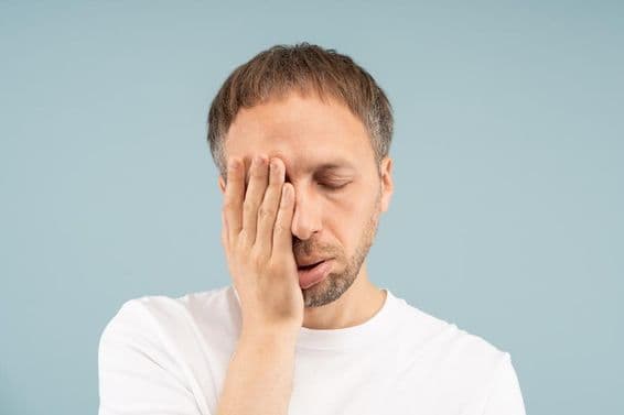 The tired man feels burned out, needs psychological help.