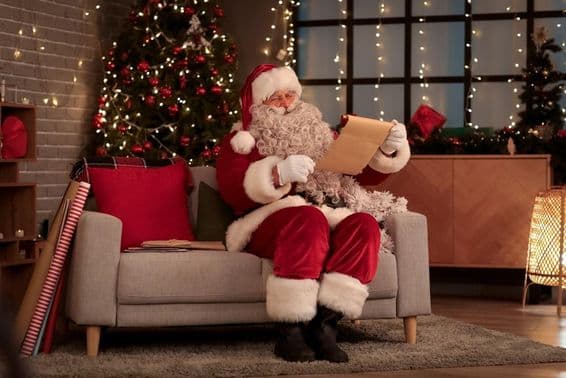 Santa sitting on a sofa.