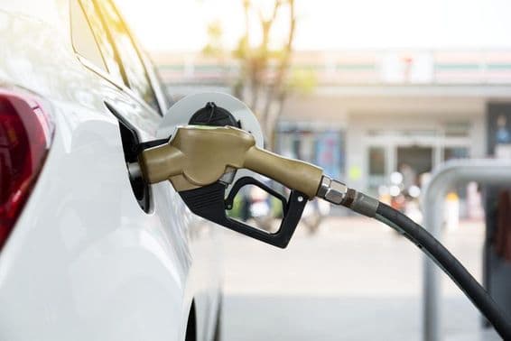 Gasoline pump nozzle in a car.
