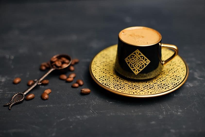 Gold-plated coffee cup and saucer.