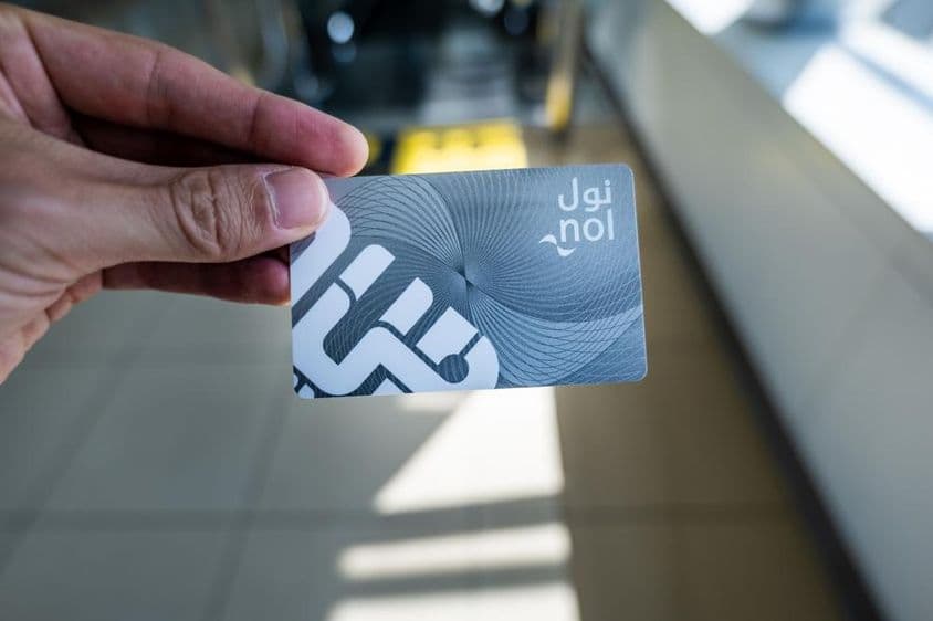 Dubai Nol card in a man's hand.