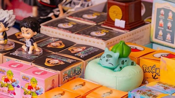 Collection of anime and game merchandise, including Pokémon Bulbasaur, Haikyuu characters, and Kirby figurines.
