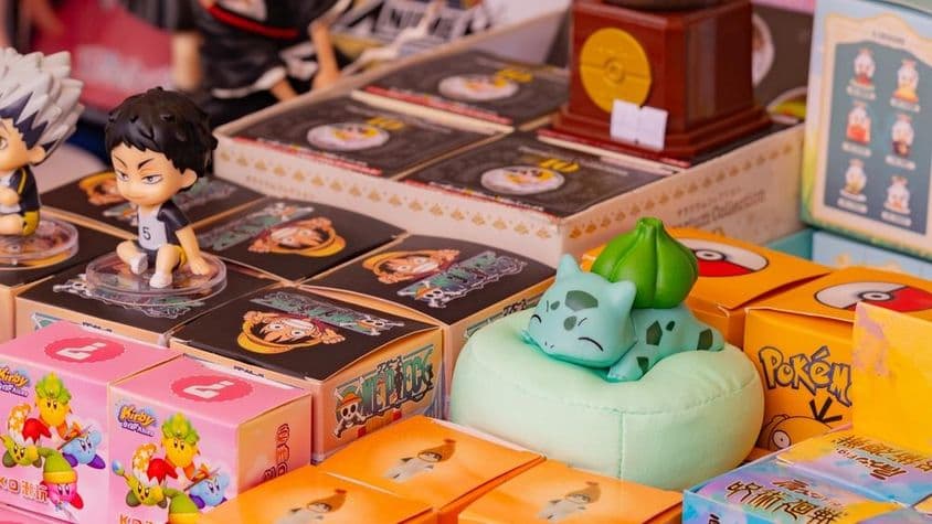 Collection of anime and game merchandise, including Pokémon Bulbasaur, Haikyuu characters, and Kirby figurines.