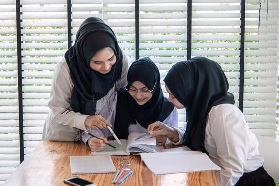 Muslim children in a classroom, happily learning.