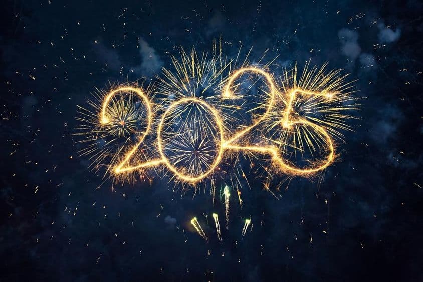 Happy New Year 2025, gold fireworks and sparkling numbers, 2025 against night blue sky background.