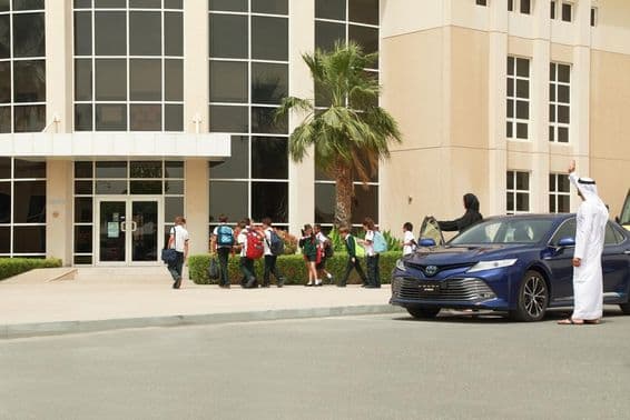 An Arab couple taking their children to school.