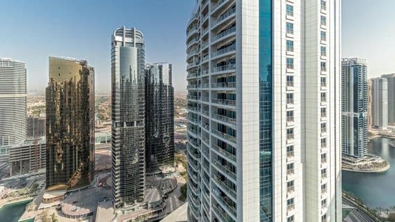 Aerial view of tall residential buildings in the JLT district, mixed-use area of Dubai multi commodities center.