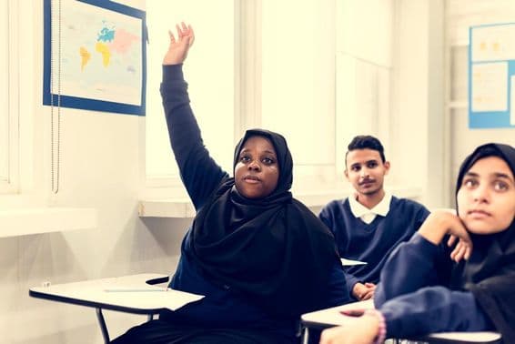 Muslim children studying in a classroom