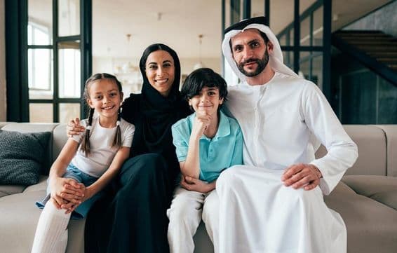 Traditional Arab family from Dubai spending time together in their home.