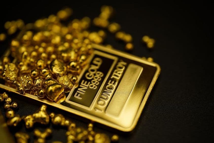 Melted gold and gold bars with 999.9 purity.