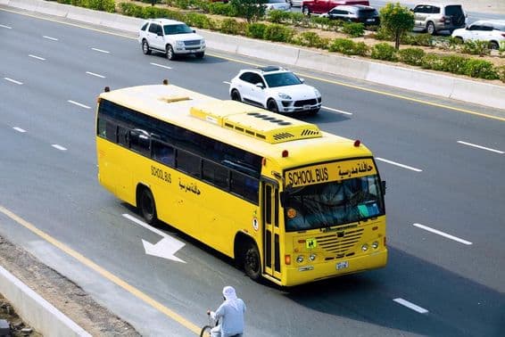 Dubai school bus on the highway.