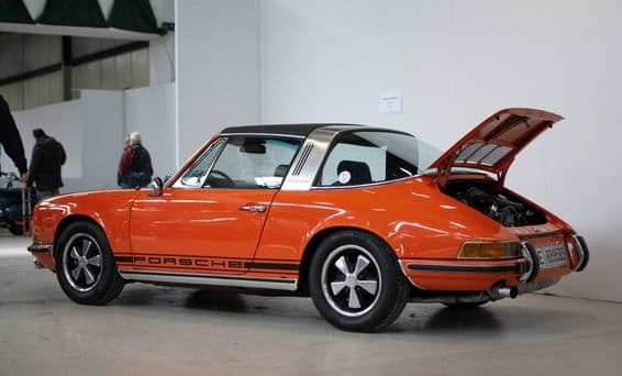 Classic Porsche 911s in orange color.
