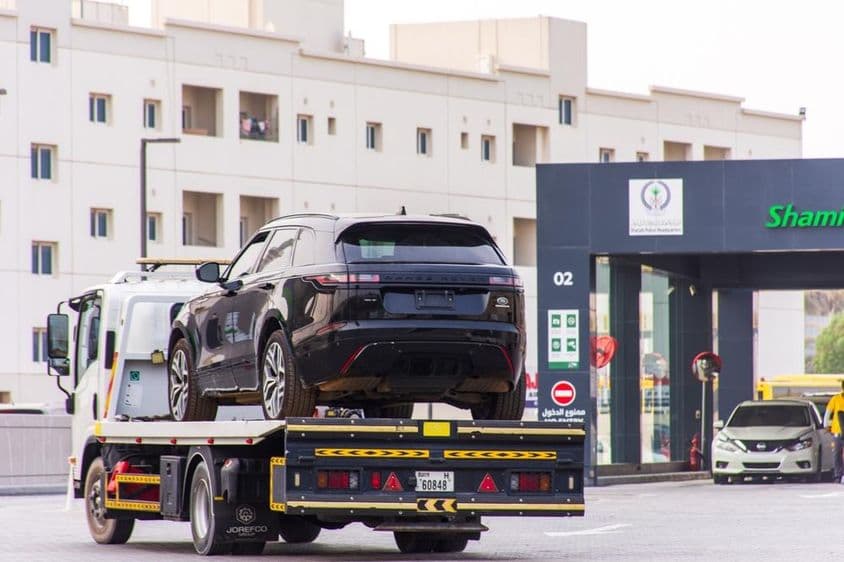 Range Rover Velar on a tow truck in Sharjah City.