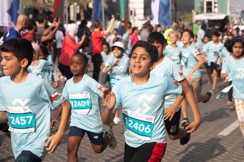Children running a 3 km marathon.