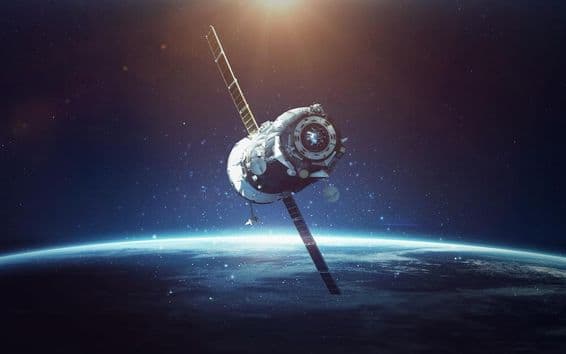 Satellite with blue planet in background.